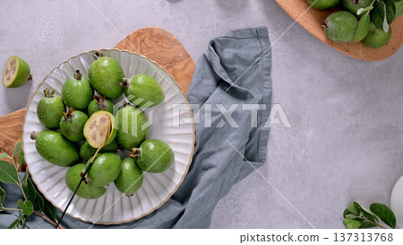 Fresh Green Feijoa Fruits on White Ceramic Plate Top View Fresh Green Feijoa Fruits on White Ceramic Plate Top View 137313768