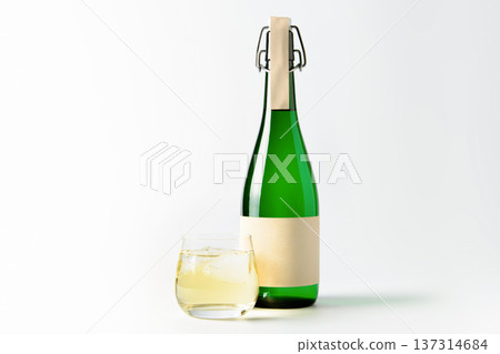 Japanese sake bottle and glass (rock) Image of sake on white background Japanese sake bottle and glass (rock) Image of sake on white background 137314684