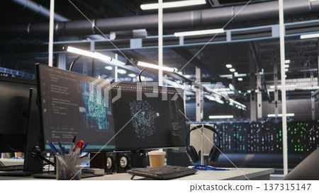 Monitors displaying status of data center hardware supporting AI training workflows and automated infrastructure systems. PC screens tracking servers processing machine learning datasets 137315147