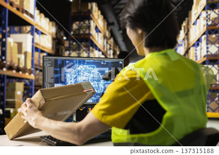 Asian staff member using artificial intelligence to scan shipping labels, registering barcodes with shipment details with AI support brain automation. E-commerce operations with virtual help. Asian staff member using artificial intelligence to scan shipping labels, registering barcodes with shipment details with AI support brain automation. E-commerce operations with virtual help. 137315188