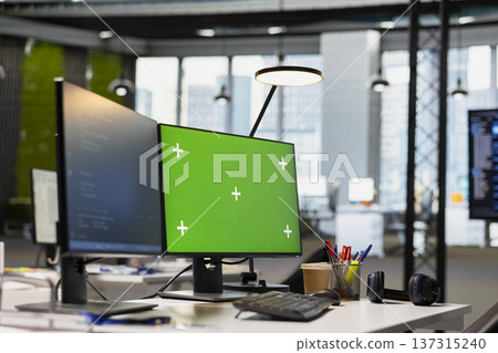 Green screen PC in AI startup workspace leveraging machine learning technology to automate scripts. Empty office with AI tools running on chroma key PC to review code files for potential bugs 137315240