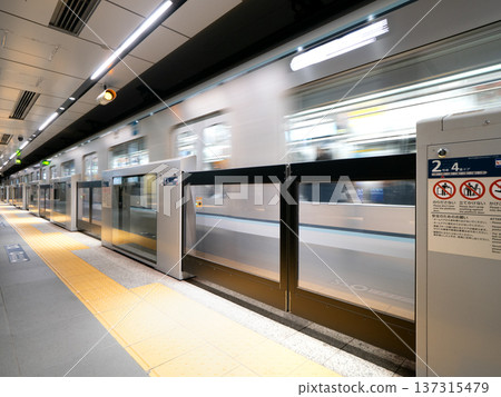 Subway car departing from platform, Tokyo Subway car departing from platform, Tokyo 137315479