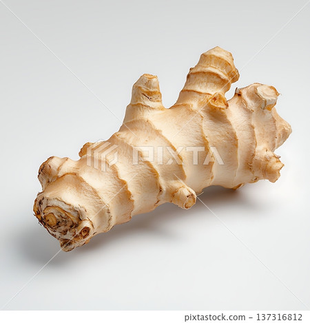 Fresh organic ginger root over a clean white background for culinary and wellness uses 137316812
