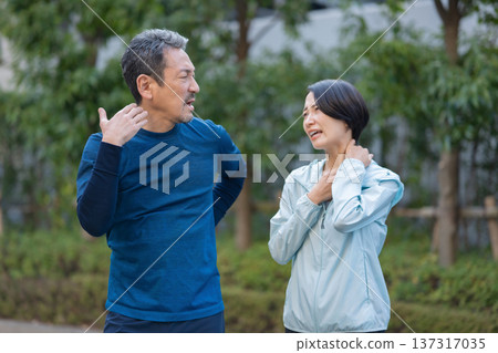 Men and women exercising and sweating Men and women exercising and sweating 137317035