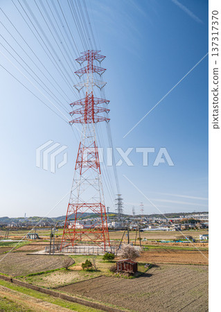 Steel tower standing in a rice field, Kyotanabe City, Kyoto Prefecture 137317370