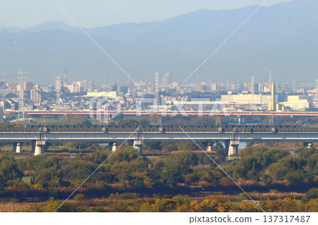 Rinkai Line 70-000 series train running directly to the Saikyo Line crossing the Arakawa River and Toda Bridge 137317487