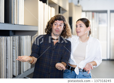 Nice couple in hardware store looking to buy bathroom tiles Nice couple in hardware store looking to buy bathroom tiles 137318245