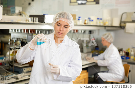 Portrait of young woman lab technician working Portrait of young woman lab technician working 137318396