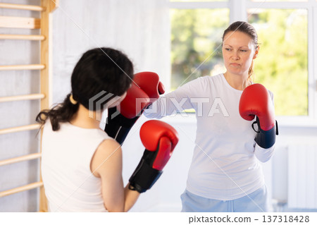women show their boxing prowess women show their boxing prowess 137318428