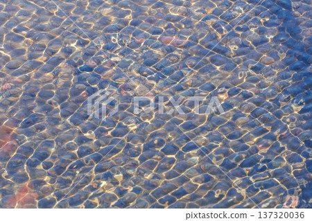 Ripples in clear water Ripples in clear water 137320036