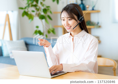 Woman studying at home Woman studying at home 137320846