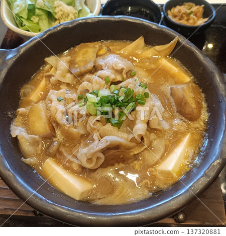 Japanese hot pot pork belly tofu green onion miso soup comfort food warmly simmering Japanese hot pot with pork belly tofu 137320881