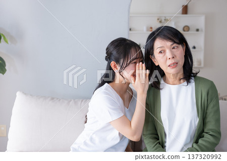 Mother and daughter who talks on secrets Mother and daughter who talks on secrets 137320992