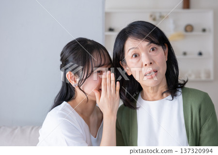 Mother and daughter who talks on secrets Mother and daughter who talks on secrets 137320994