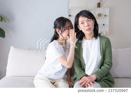 Mother and daughter who talks on secrets Mother and daughter who talks on secrets 137320997