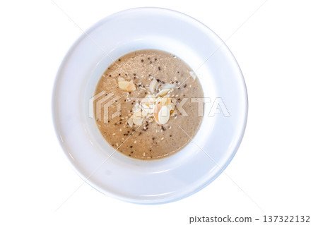 Die cut of pumpkin Soup with Almond and Crispy Bread Toast on white isolated 137322132