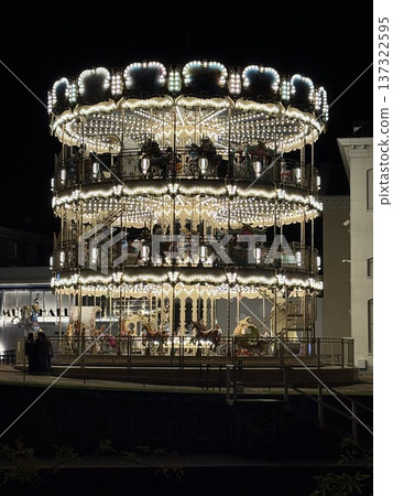 Illuminated merry-go-round at night Illuminated merry-go-round at night 137322595
