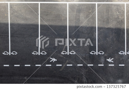 Electric vehicle parking spaces in a public parking lot during daylight 137325767