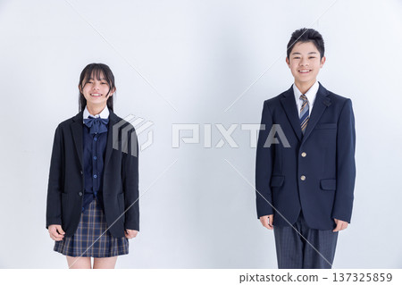 Smiling students in uniforms, male and female Smiling students in uniforms, male and female 137325859
