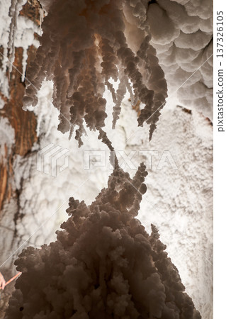 A stunning view of an underground cavern showcases unique formations made of crystals and natural structures, created by the passage of time. A stunning view of an underground cavern showcases unique formations made of crystals and natural structures, created by the passage of time. 137326105