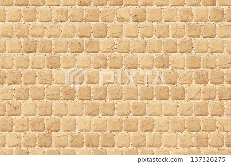 Uniform beige cobblestone pavement texture background for outdoor patio or garden walkway surface design 137326275