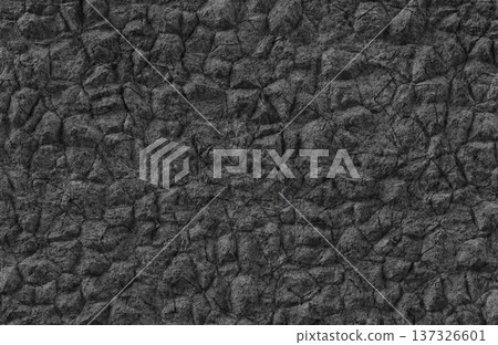 Dark grey rough stone wall texture with irregular blocks and deep shadows for backdrop. Dark grey rough stone wall texture with irregular blocks and deep shadows for backdrop. 137326601