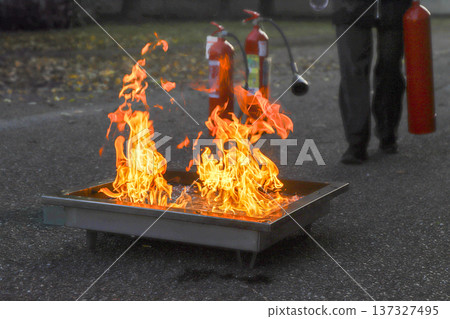 corporate safety - exercise during a firefighting course corporate safety - exercise during a firefighting course 137327495
