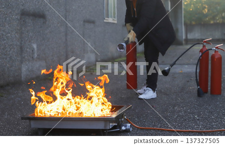 corporate safety - exercise during a firefighting course 137327505