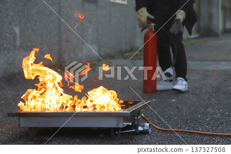corporate safety - exercise during a firefighting course corporate safety - exercise during a firefighting course 137327508