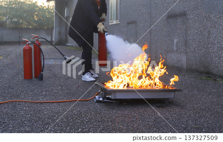 corporate safety - exercise during a firefighting course corporate safety - exercise during a firefighting course 137327509