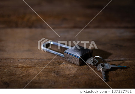 House keys left on an empty table symbolizing abandonment, separation, loneliness, and emotional loss. House keys left on an empty table symbolizing abandonment, separation, loneliness, and emotional loss. 137327791