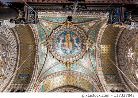 Lyon, france. December 27,2023. Basilica notre dame de fourviere ceiling showing intricate mosaic art depicting religious figures and gold patterns in lyon, france 137327842