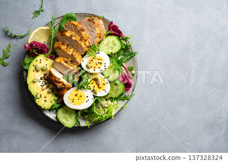 High protein lunch bowl with chicken, eggs and vegetables 137328324