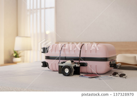 Camera beside pink luggage suitcase with passport and boarding pass aside sunglasses and hat on bed. 137328970