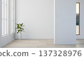 Green potted plant aside glass window and square pillar on wooden parquet floor in white wall room. 137328976
