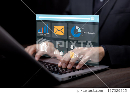 Businessman analyzing digital marketing dashboard on laptop showing email campaign metrics, open rate, click-through rate, and business analytics for online marketing performance and data-driven strat Businessman analyzing digital marketing dashboard on laptop showing email campaign metrics, open rate, click-through rate, and business analytics for online marketing performance and data-driven strat 137329225