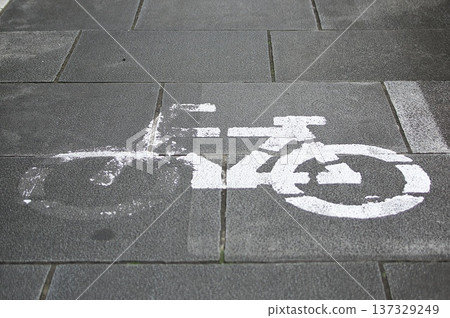 The revised Road Traffic Act tightens bicycle traffic rules and improves manners. Bicycle lane markings painted on the road. 137329249