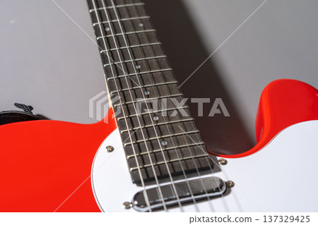 Electric Guitar Body Close-Up on gray background Electric Guitar Body Close-Up on gray background 137329425