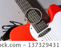 Red Guitar with Coiled Strings 137329431