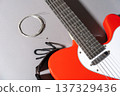 Red Guitar with Strings and Strap 137329436