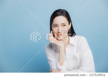 A woman with a white shirt A woman with a white shirt 137329952