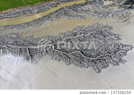 Aerial view of abstract mud nature pattern in mining decanting lake 137330250