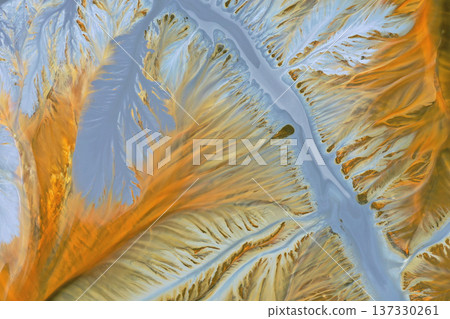 Aerial abstract surreal natural patterns above. Colorful chemical mining leach residues in decanting pond Aerial abstract surreal natural patterns above. Colorful chemical mining leach residues in decanting pond 137330261