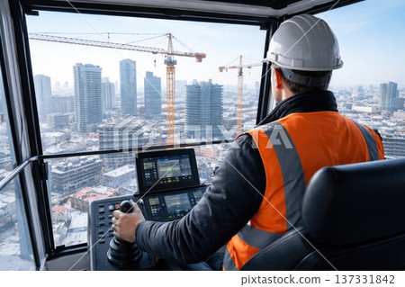 Tower crane operator working at construction site with city skyline in background Tower crane operator working at construction site with city skyline in background 137331842