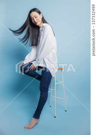 A woman with a white shirt A woman with a white shirt 137332499