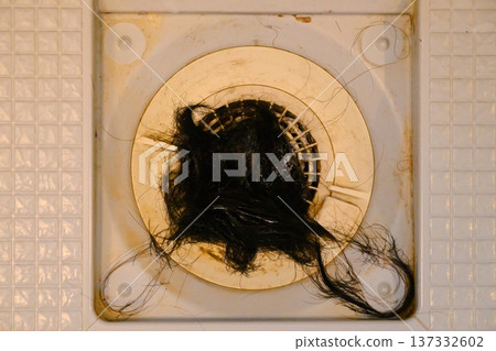A lot of hair and dirt stuck in the drain A lot of hair and dirt stuck in the drain 137332602