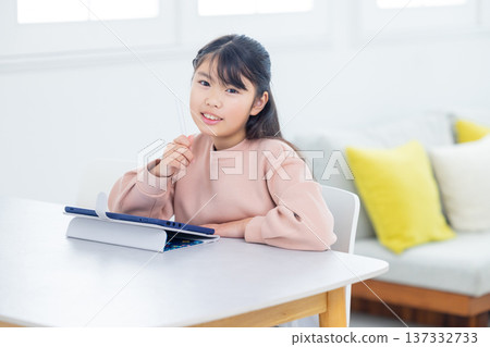 Elementary school students studying on tablets Elementary school students studying on tablets 137332733