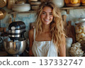 Smiling Woman With Mixer In Cozy Kitchen 137332747