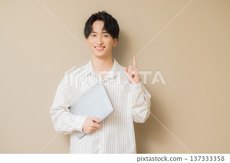 Man using a computer Man using a computer 137333358