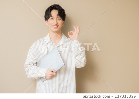Man using a computer Man using a computer 137333359